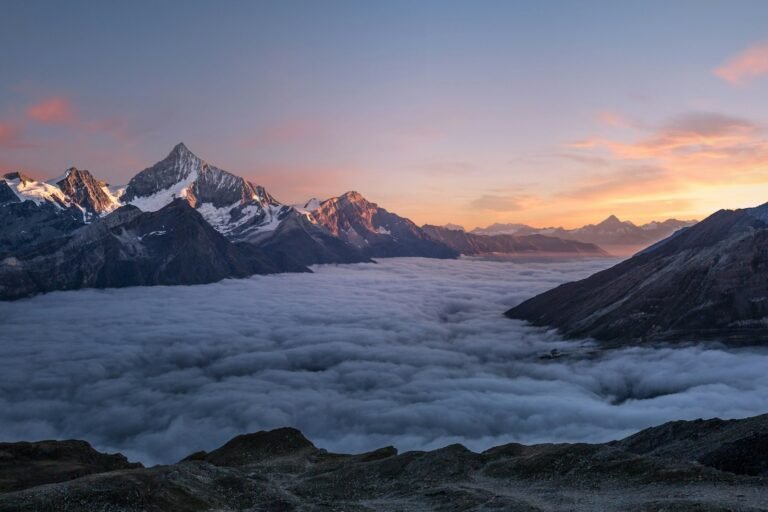Snow-capped mountain peak at dusk
