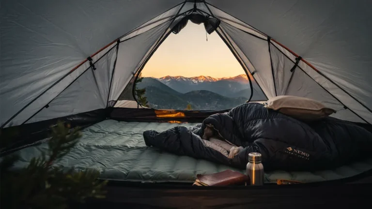 Sleeping pad and bag inside a tent with a mountain view